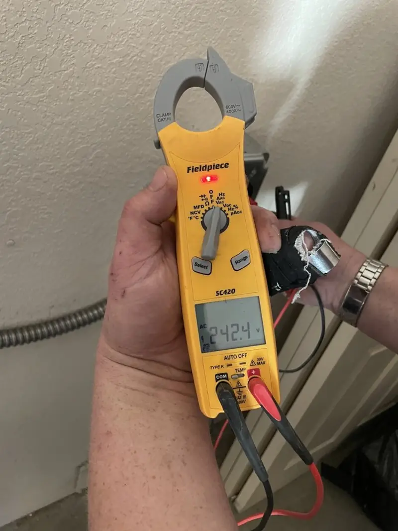 Voltage testing with clamp meter during Ceiling Fan Installation in Cheboygan
